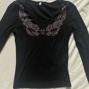 Black long sleeve top with rhinestone wings
